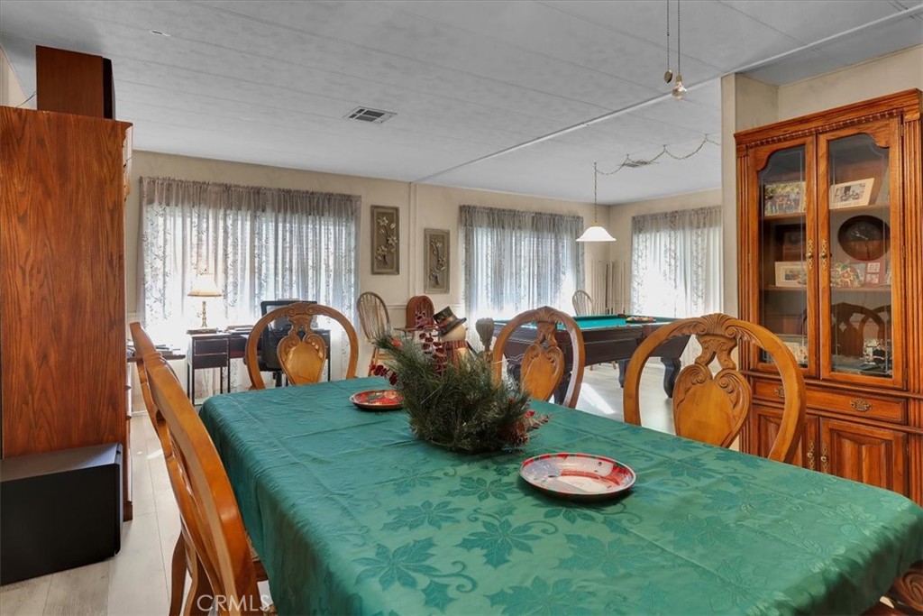 9800 Base Line Road, Unit 114 Rancho Cucamonga, CA 91701 - Photo 18 of 48 a view of a dining room with furniture