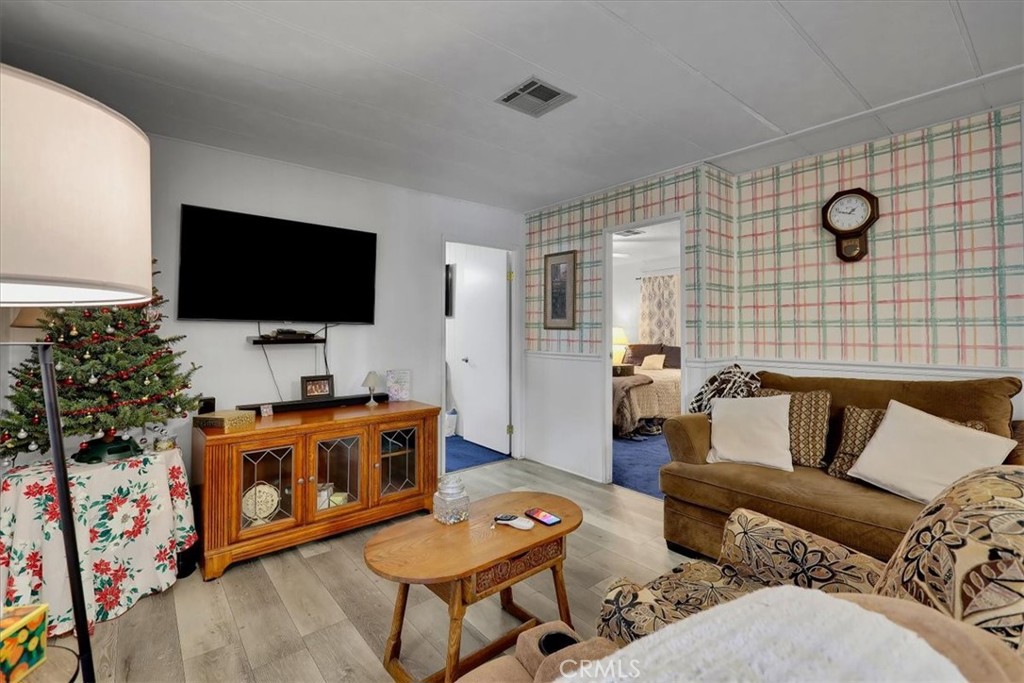 9800 Base Line Road, Unit 114 Rancho Cucamonga, CA 91701 - Photo 22 of 48 a living room with furniture and a flat screen tv