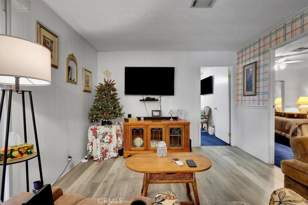 9800 Base Line Road, Unit 114 Rancho Cucamonga, CA 91701 - Photo 23 of 48 a living room with furniture and a flat screen tv