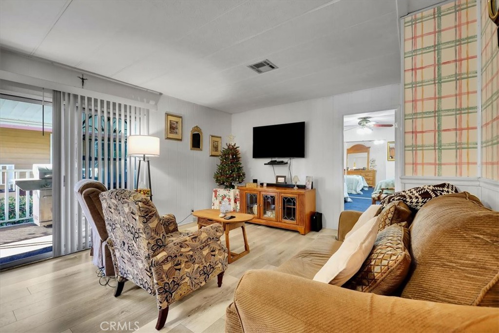 9800 Base Line Road, Unit 114 Rancho Cucamonga, CA 91701 - Photo 24 of 48 a living room with furniture and a flat screen tv