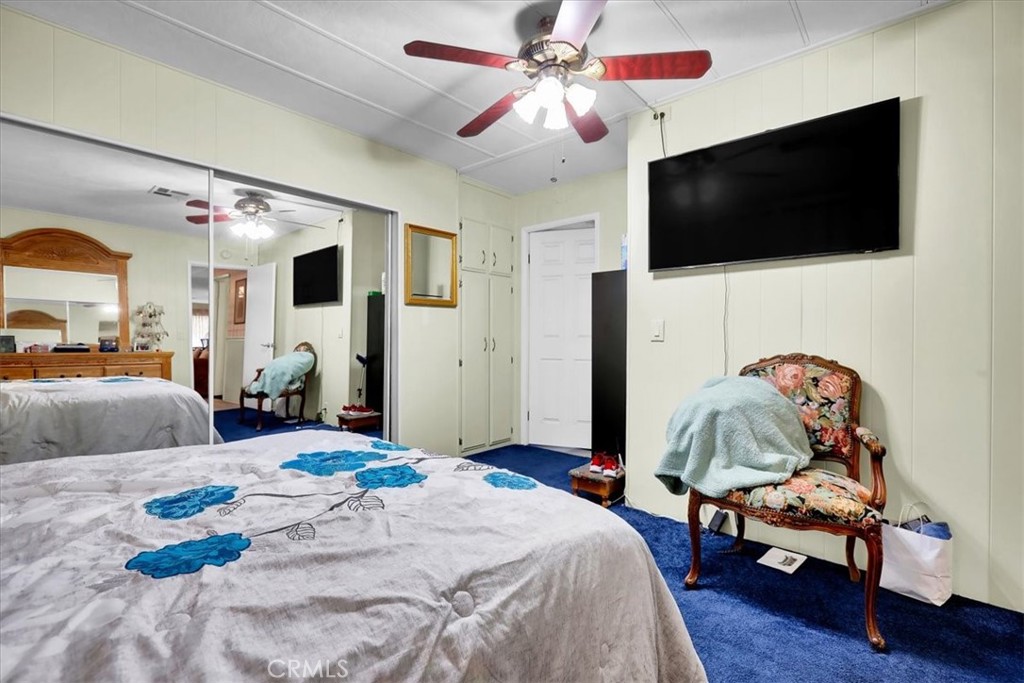 9800 Base Line Road, Unit 114 Rancho Cucamonga, CA 91701 - Photo 28 of 48 a bedroom with a bed window and flat screen tv