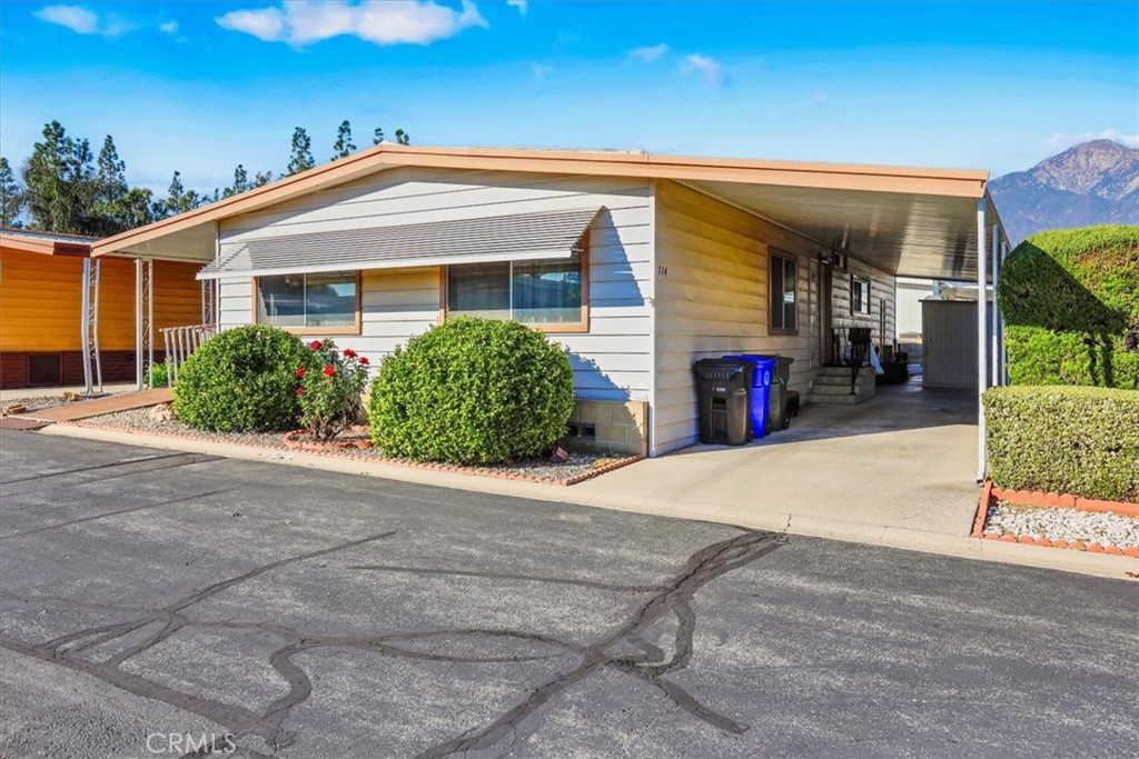 9800 Base Line Road, Unit 114 Rancho Cucamonga, CA 91701 - Photo 3 of 48 a front view of house with yard