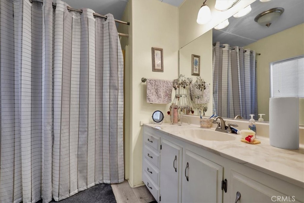 9800 Base Line Road, Unit 114 Rancho Cucamonga, CA 91701 - Photo 32 of 48 a bathroom with a sink and a mirror