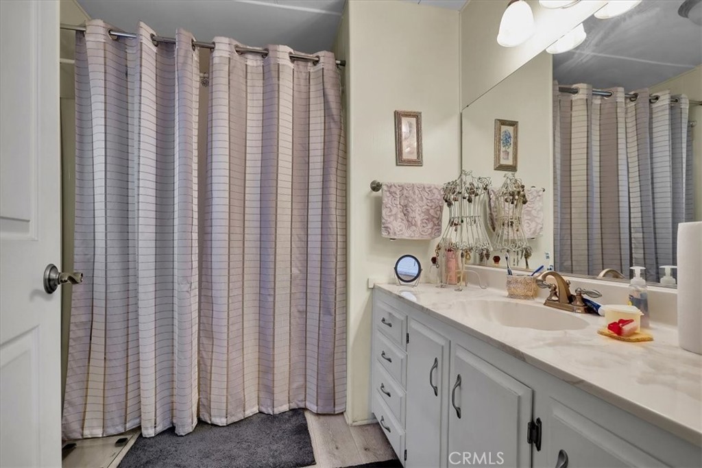 9800 Base Line Road, Unit 114 Rancho Cucamonga, CA 91701 - Photo 33 of 48 a bathroom with a double vanity sink and a mirror