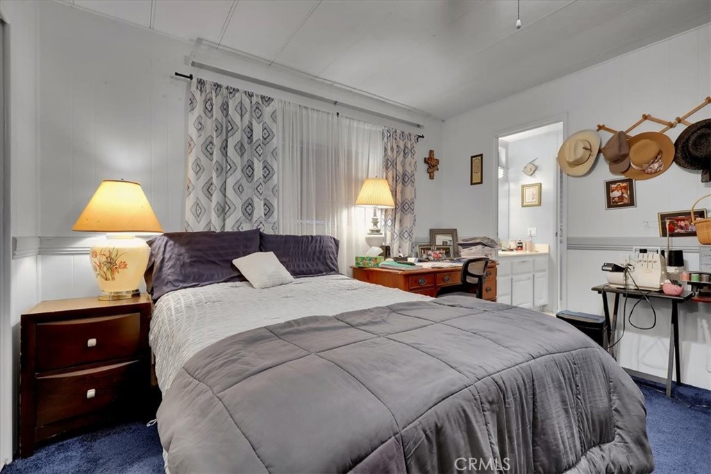 9800 Base Line Road, Unit 114 Rancho Cucamonga, CA 91701 - Photo 36 of 48 a bedroom with a bed and a table