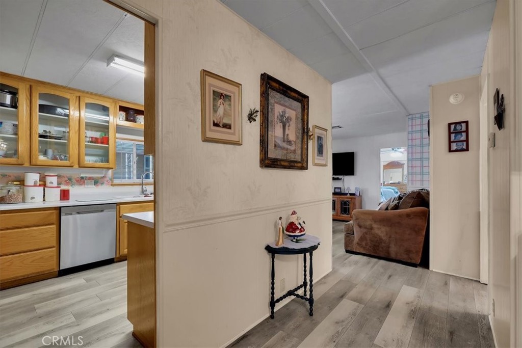 9800 Base Line Road, Unit 114 Rancho Cucamonga, CA 91701 - Photo 40 of 48 a living room with furniture and a kitchen