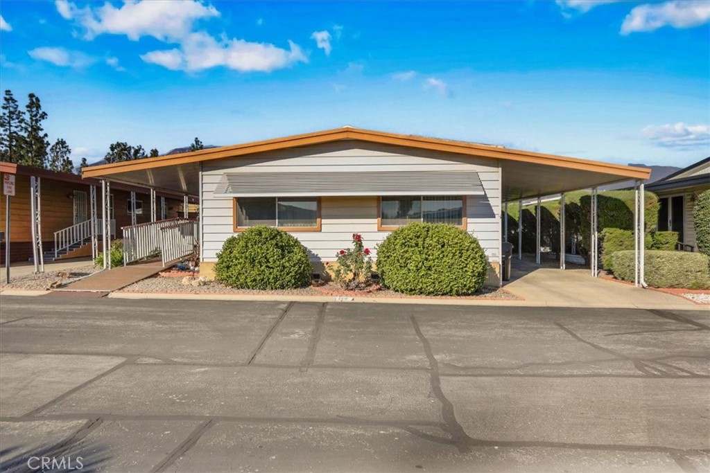 9800 Base Line Road, Unit 114 Rancho Cucamonga, CA 91701 - Photo 4 of 48 a front view of a house with garden