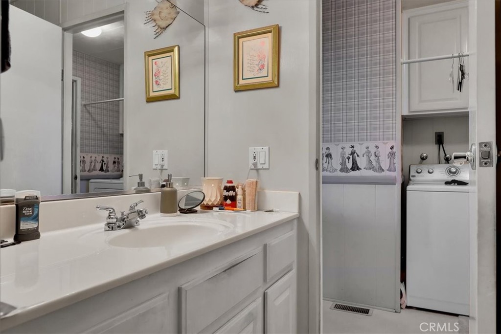 9800 Base Line Road, Unit 114 Rancho Cucamonga, CA 91701 - Photo 41 of 48 a bathroom with a sink double vanity and a mirror