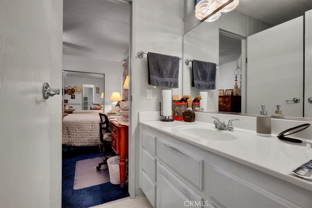 9800 Base Line Road, Unit 114 Rancho Cucamonga, CA 91701 - Photo 42 of 48 a en suite bathroom with a double sink and a mirror