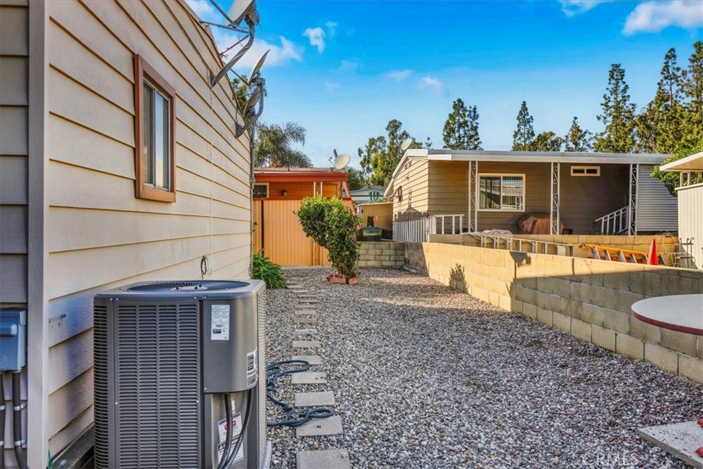 9800 Base Line Road, Unit 114 Rancho Cucamonga, CA 91701 - Photo 43 of 48 a view of a house with a patio