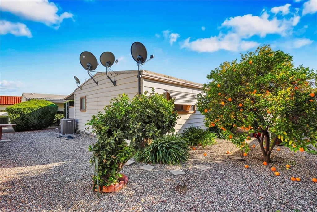 9800 Base Line Road, Unit 114 Rancho Cucamonga, CA 91701 - Photo 47 of 48 a front view of a house with garden