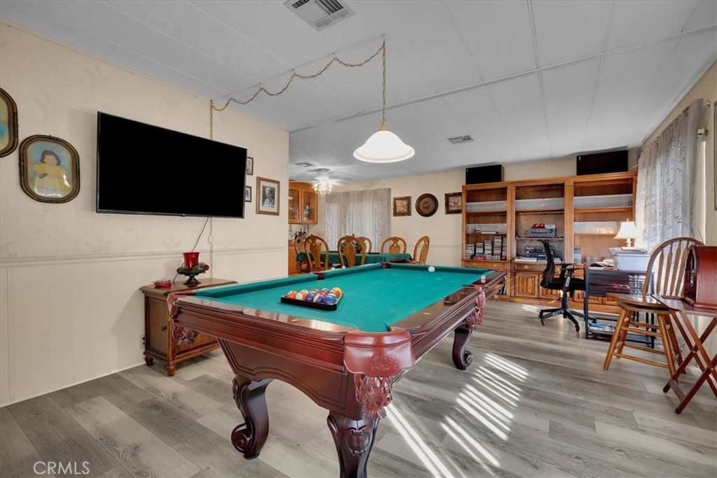 9800 Base Line Road, Unit 114 Rancho Cucamonga, CA 91701 - Photo 6 of 48 a living room with furniture a flat screen tv and floor to ceiling window