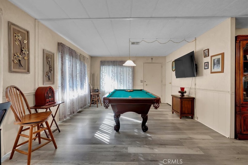 9800 Base Line Road, Unit 114 Rancho Cucamonga, CA 91701 - Photo 7 of 48 a living room with furniture and a flat screen tv