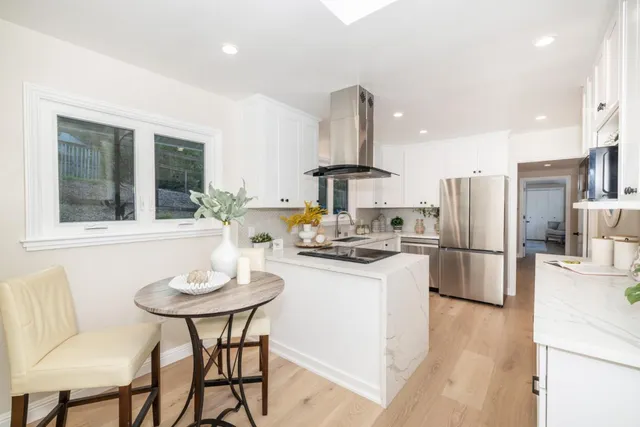 a spacious bedroom with a bed and a couch