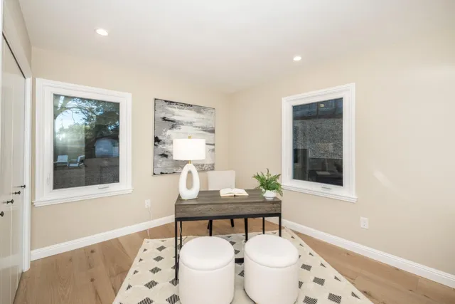 a view of a patio with table and chairs