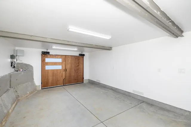 a view of an empty room with a chair