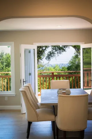 a living room with furniture a window and a chandelier