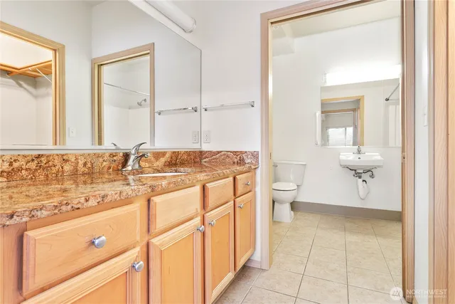 a bathroom with a sink a mirror and a bathtub