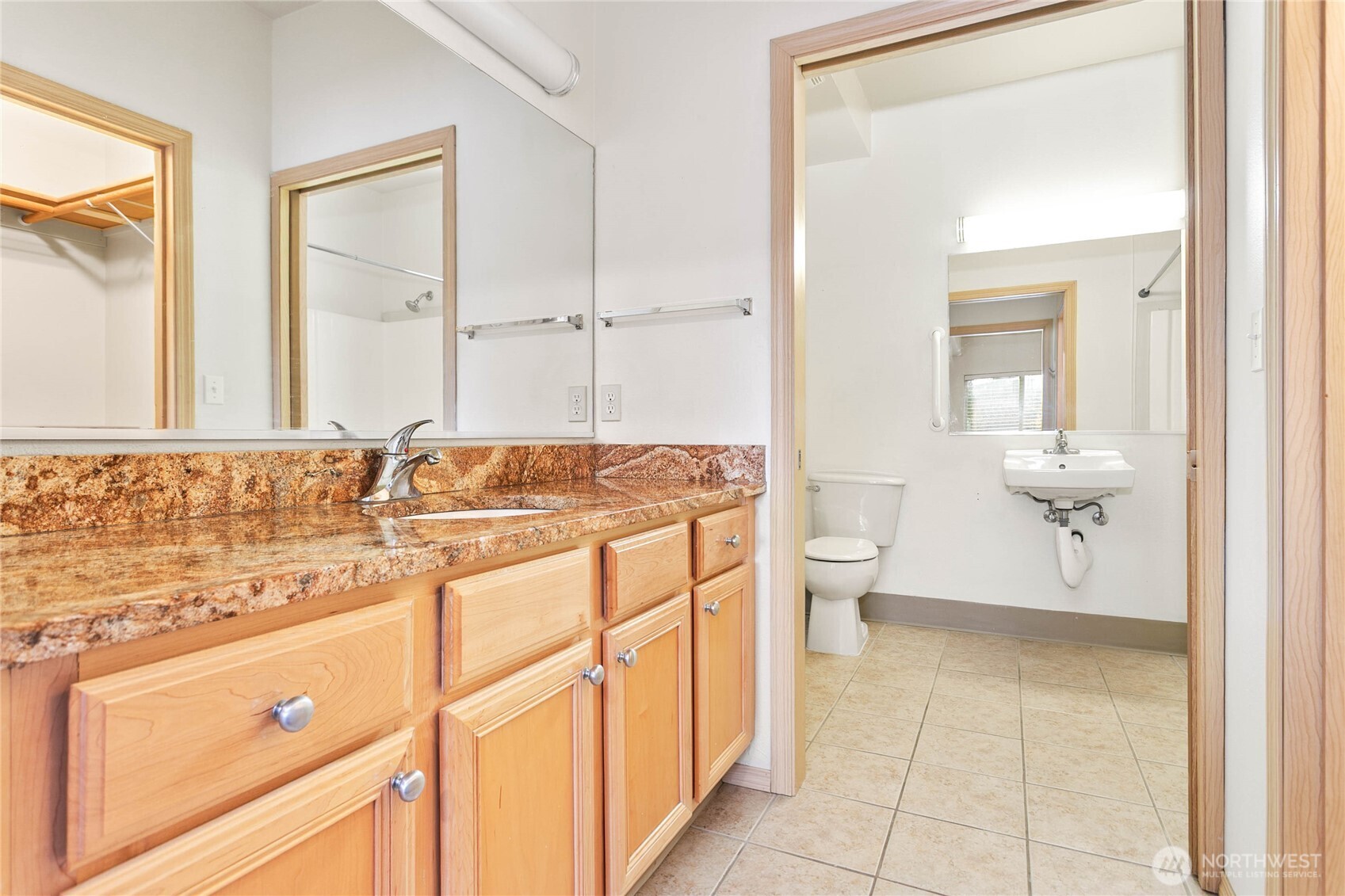 504 Darby Drive, Unit 110 Bellingham, WA 98226 - Photo 11 of 19 a bathroom with a sink a toilet and a mirror