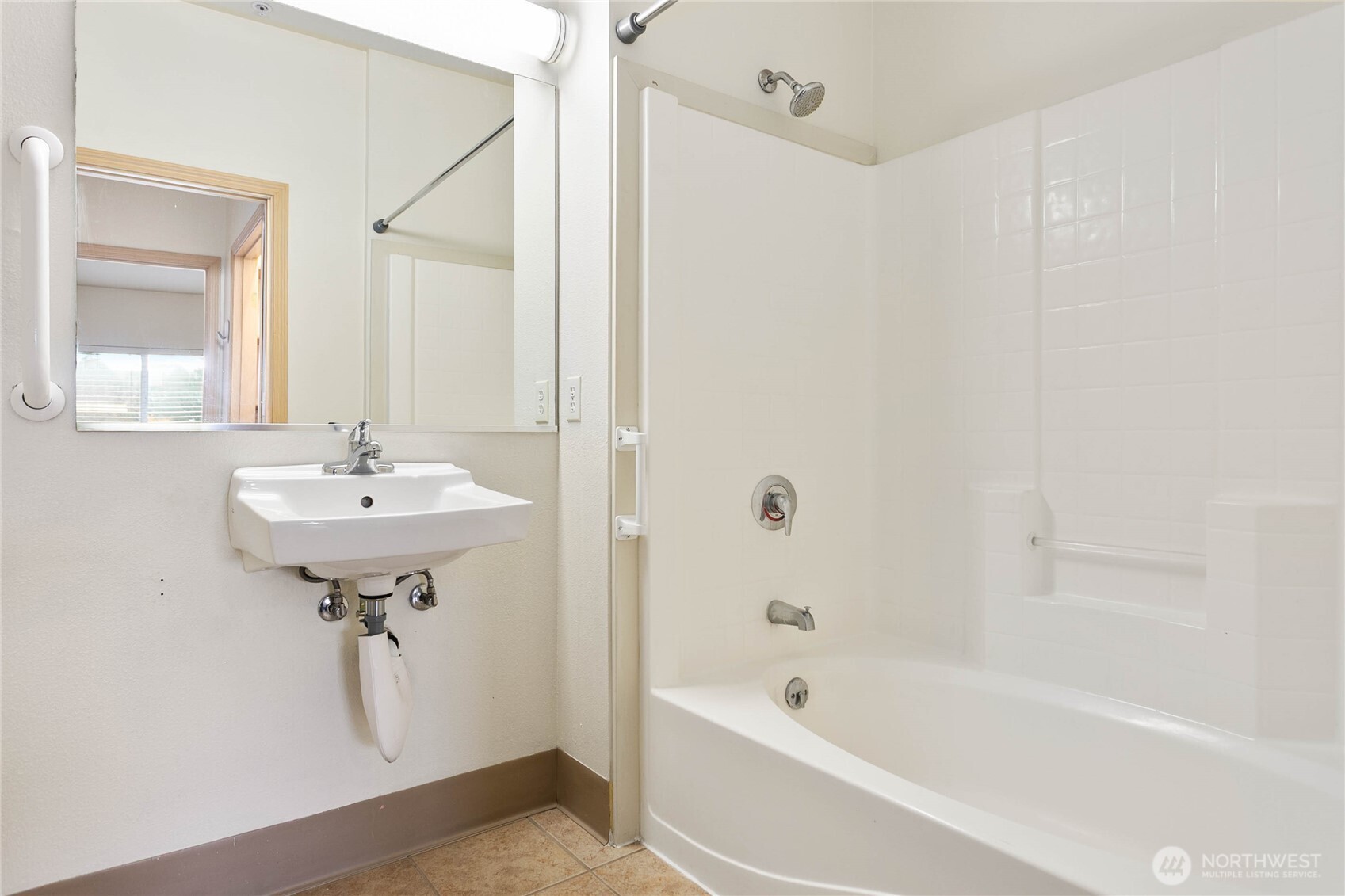 504 Darby Drive, Unit 110 Bellingham, WA 98226 - Photo 12 of 19 a bathroom with a sink a mirror and a bathtub