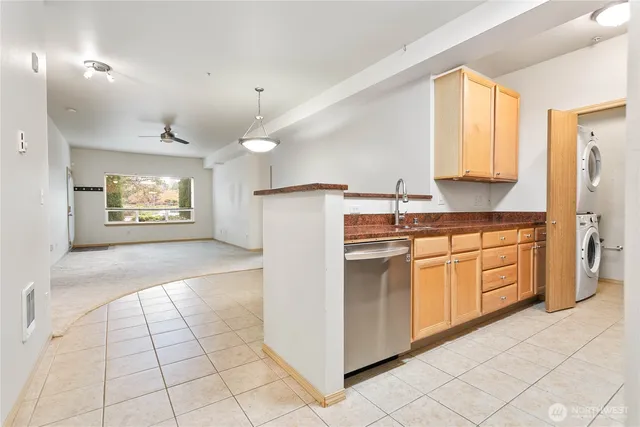 a living room with furniture a rug and a large window