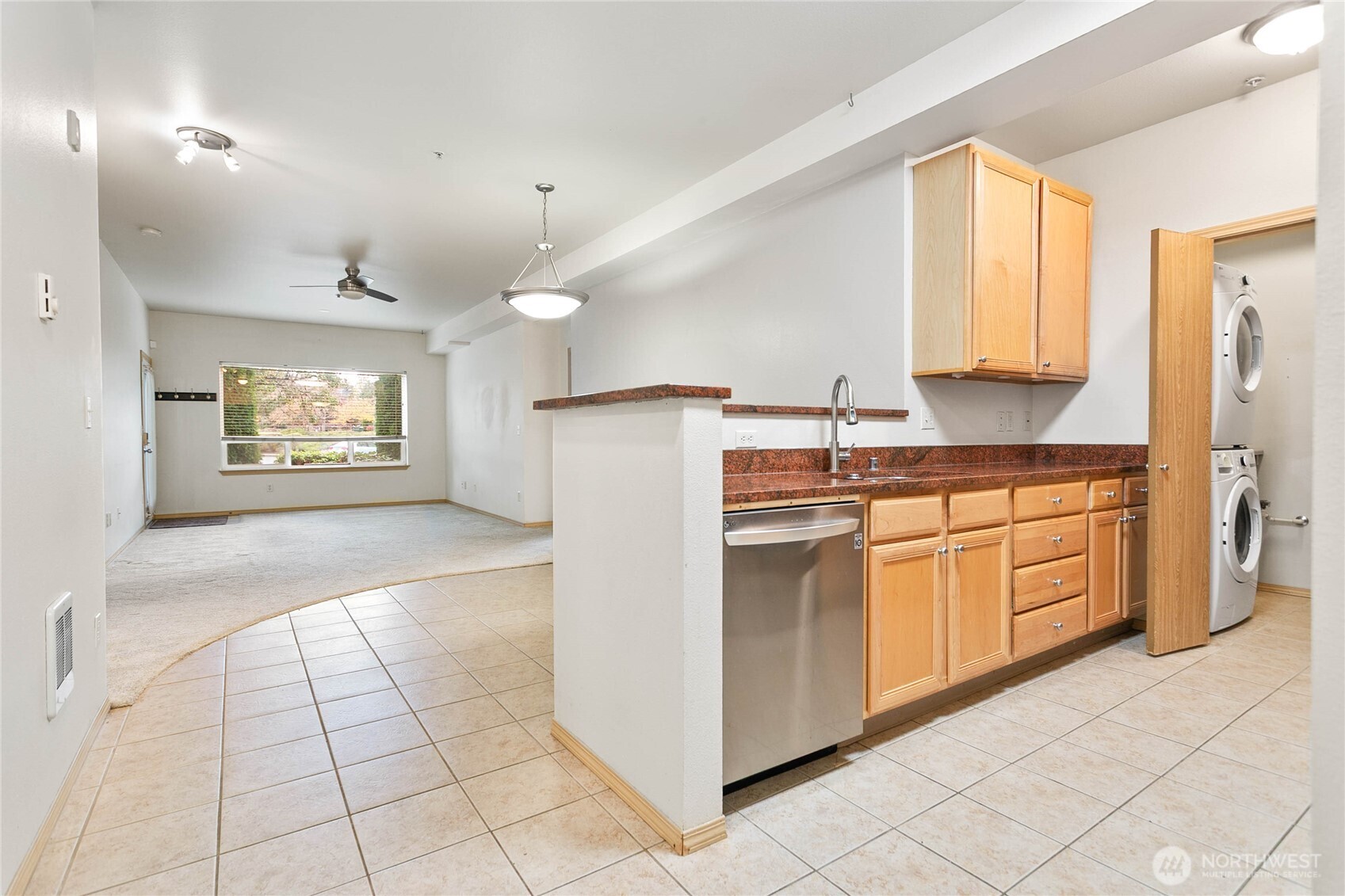 504 Darby Drive, Unit 110 Bellingham, WA 98226 - Photo 16 of 19 a kitchen with granite countertop a refrigerator and a stove top oven