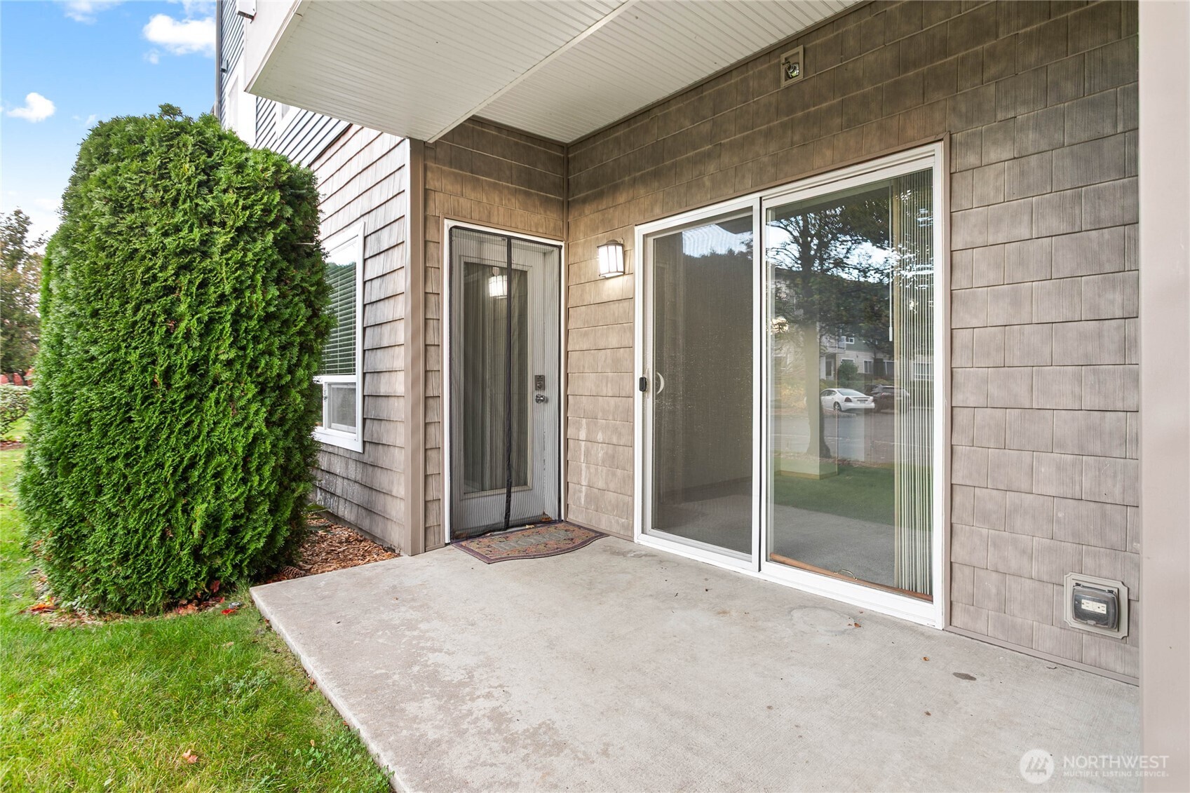 504 Darby Drive, Unit 110 Bellingham, WA 98226 - Photo 3 of 19 a view of a glass door with a yard