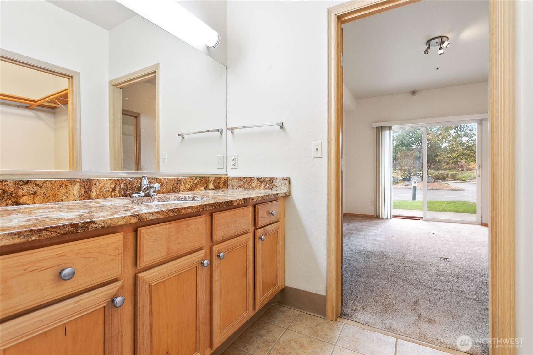 504 Darby Drive, Unit 110 Bellingham, WA 98226 - Photo 8 of 19 a bathroom with a granite countertop sink and a mirror