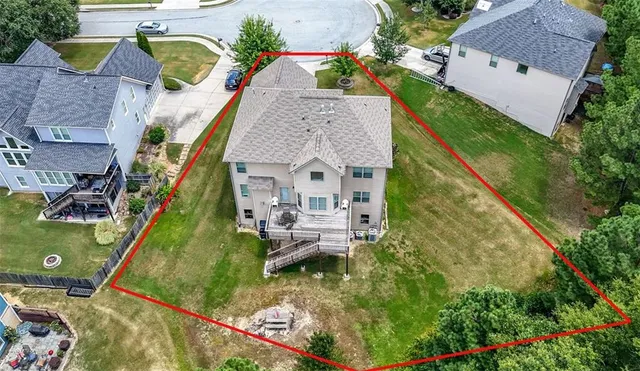 an aerial view of house with swimming pool