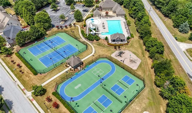 an aerial view of a pool patio outdoor seating and outdoor kitchen view