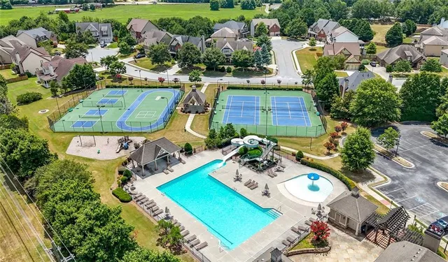 an aerial view of a house with yard swimming pool and outdoor seating