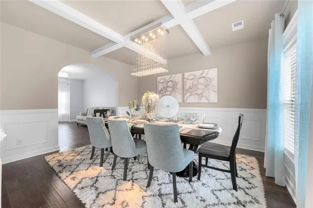a view of a dining room with furniture and wooden floor