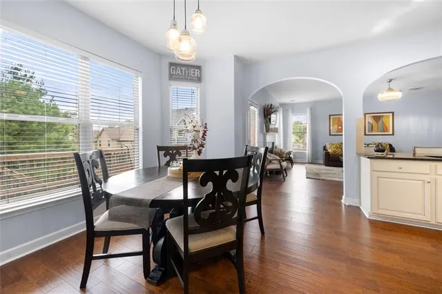a view of a dining room with furniture window and wooden floor
