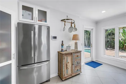 a kitchen with stainless steel appliances granite countertop a refrigerator and a stove