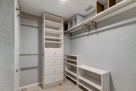 a view of an empty walk in closet