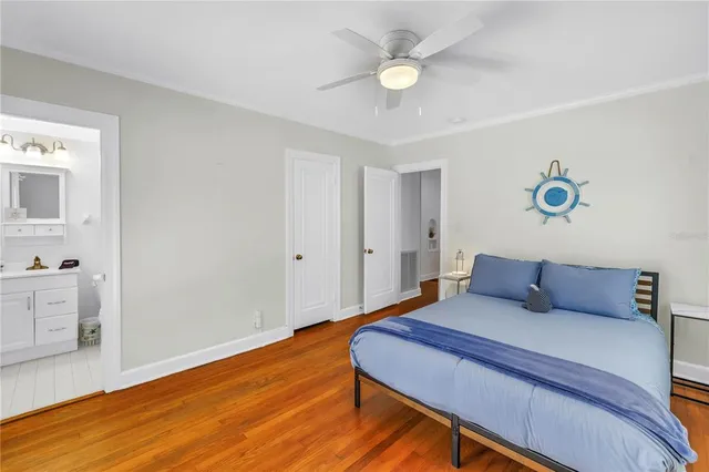 a bedroom with a bed and a table in it