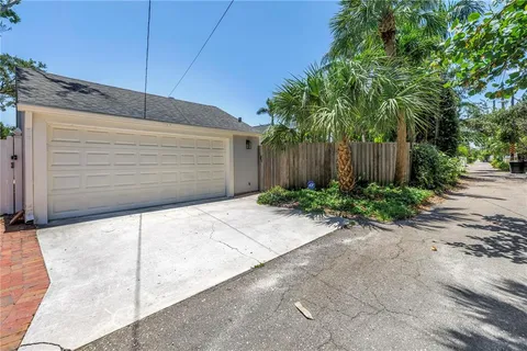 a backyard of a house with plants and trees