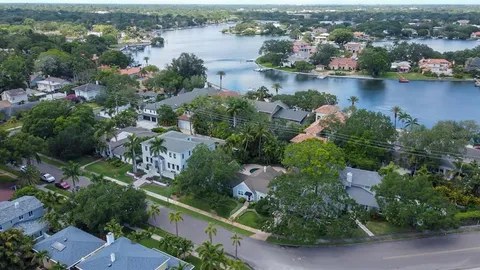 an aerial view of a city with lake view