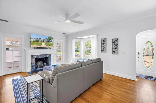 a living room with furniture and a fireplace