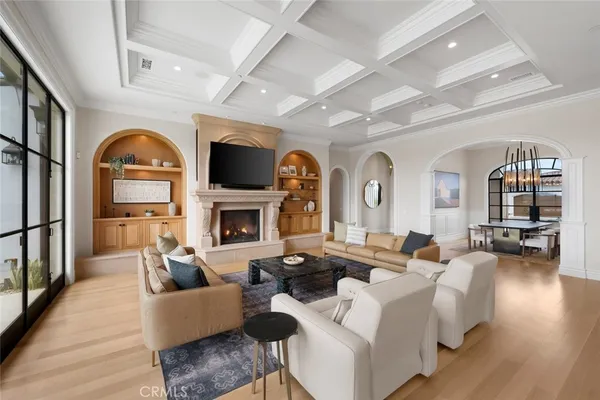 a view of a dining room with furniture wooden floor and chandelier