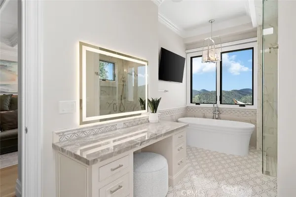 a bedroom with a bed window and a flat tv screen