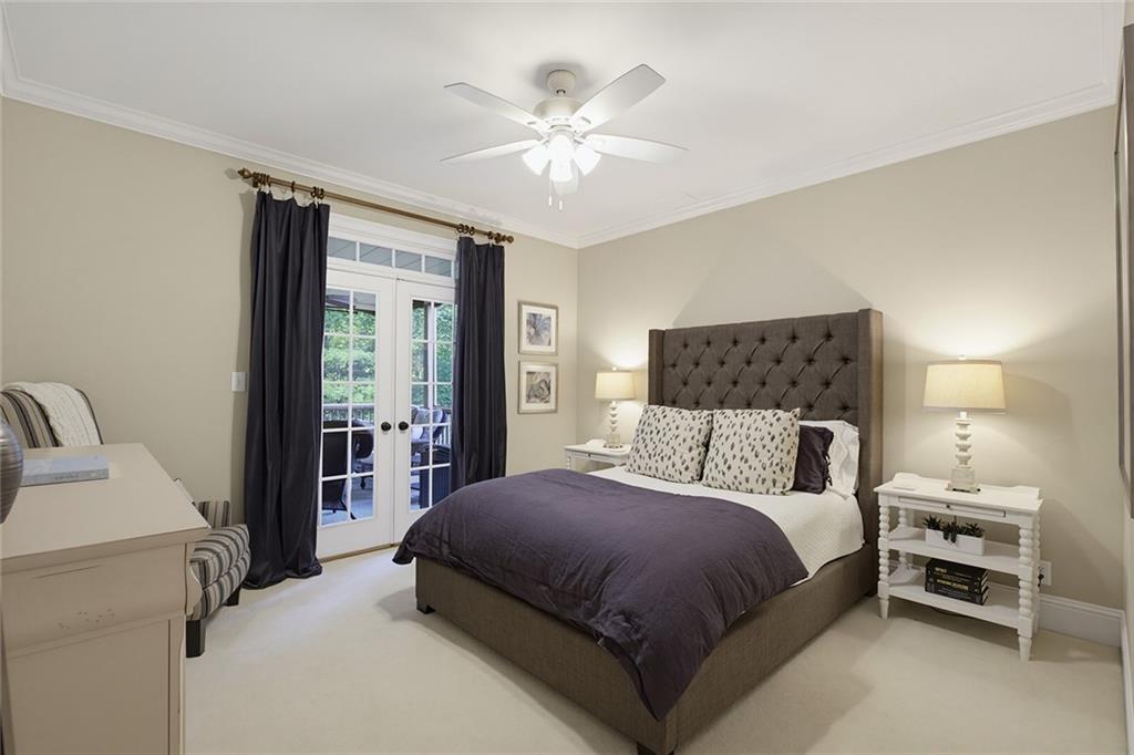 14442 Club Circle Milton, GA 30004 - Photo 20 of 82 a bedroom with a large bed and a chandelier fan