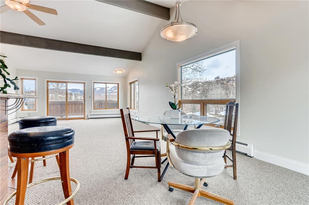 82 Canyon Trail Road Dillon, CO 80435 - Photo 20 of 31 a dining room with furniture and a floor to ceiling window