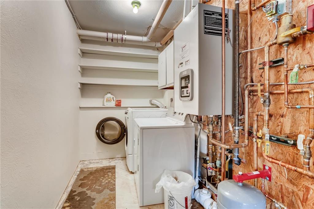 82 Canyon Trail Road Dillon, CO 80435 - Photo 28 of 31 a utility room with dryer and washer