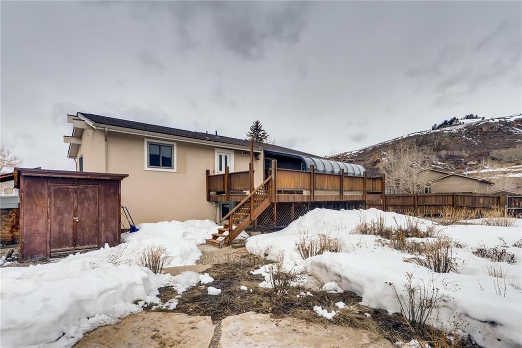 82 Canyon Trail Road Dillon, CO 80435 - Photo 29 of 31 a front view of a house with a yard covered in snow