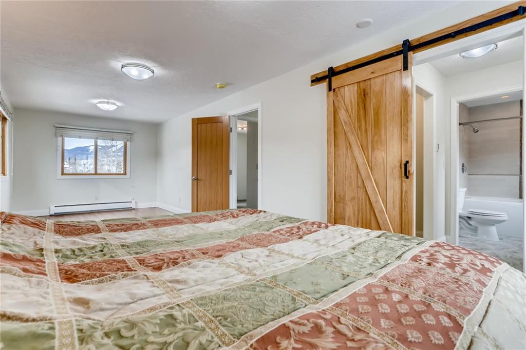 82 Canyon Trail Road Dillon, CO 80435 - Photo 6 of 31 a bedroom with a bed and a window