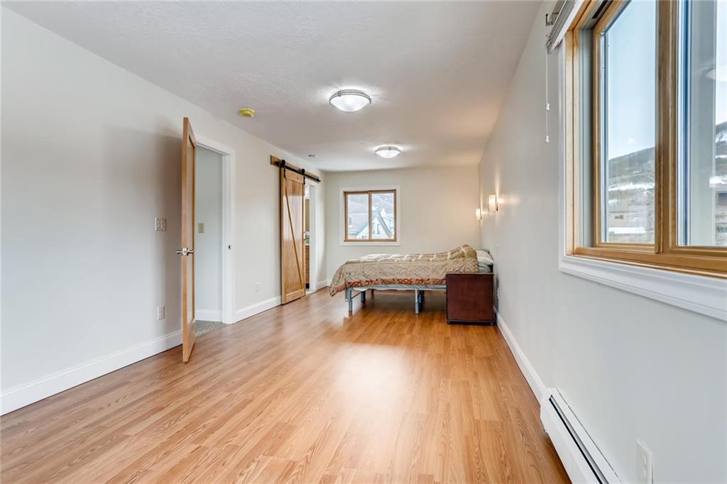 82 Canyon Trail Road Dillon, CO 80435 - Photo 10 of 31 an empty room with wooden floor and furniture