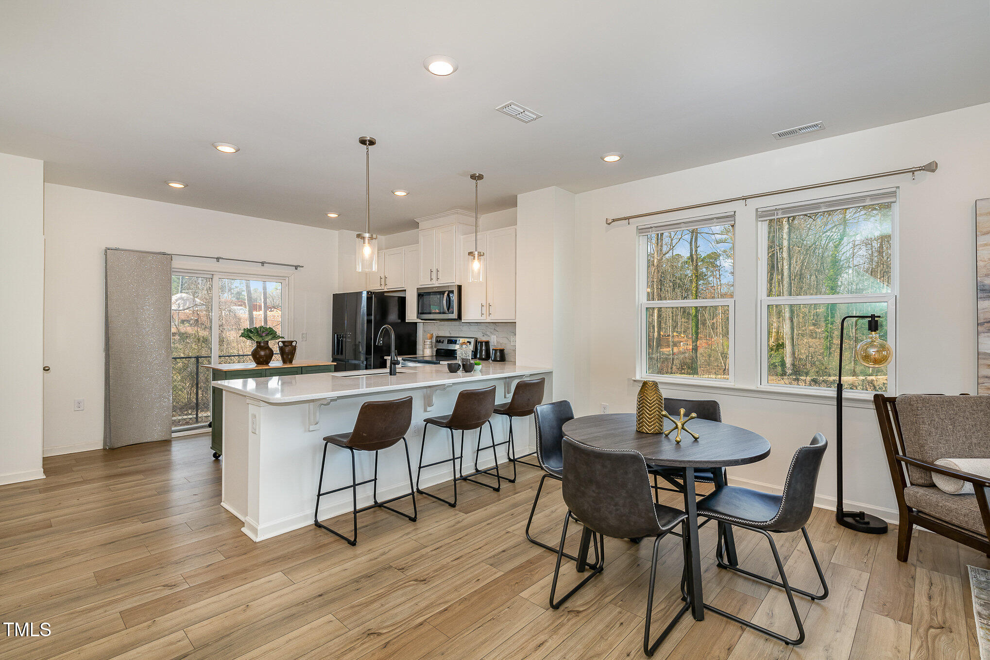 3110 Crater Loop Raleigh, NC 27610 - Photo 11 of 38 a view of a dining room with furniture and wooden floor