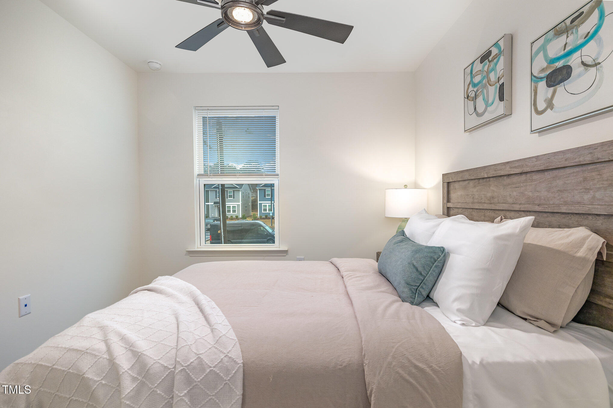 3110 Crater Loop Raleigh, NC 27610 - Photo 23 of 38 a bedroom with a bed and painting on the wall