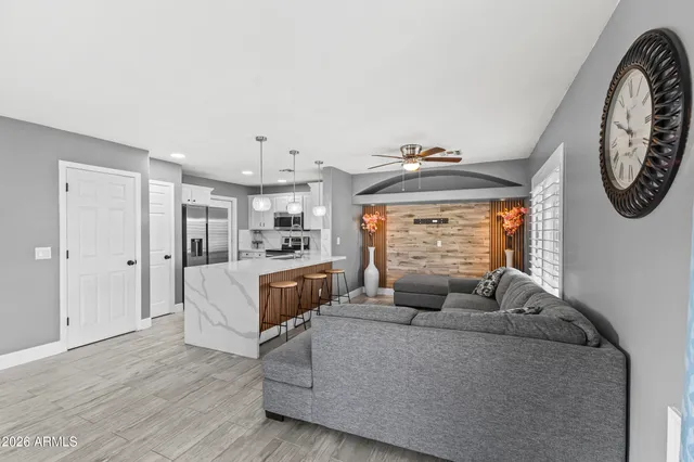 a living room with furniture and a large window